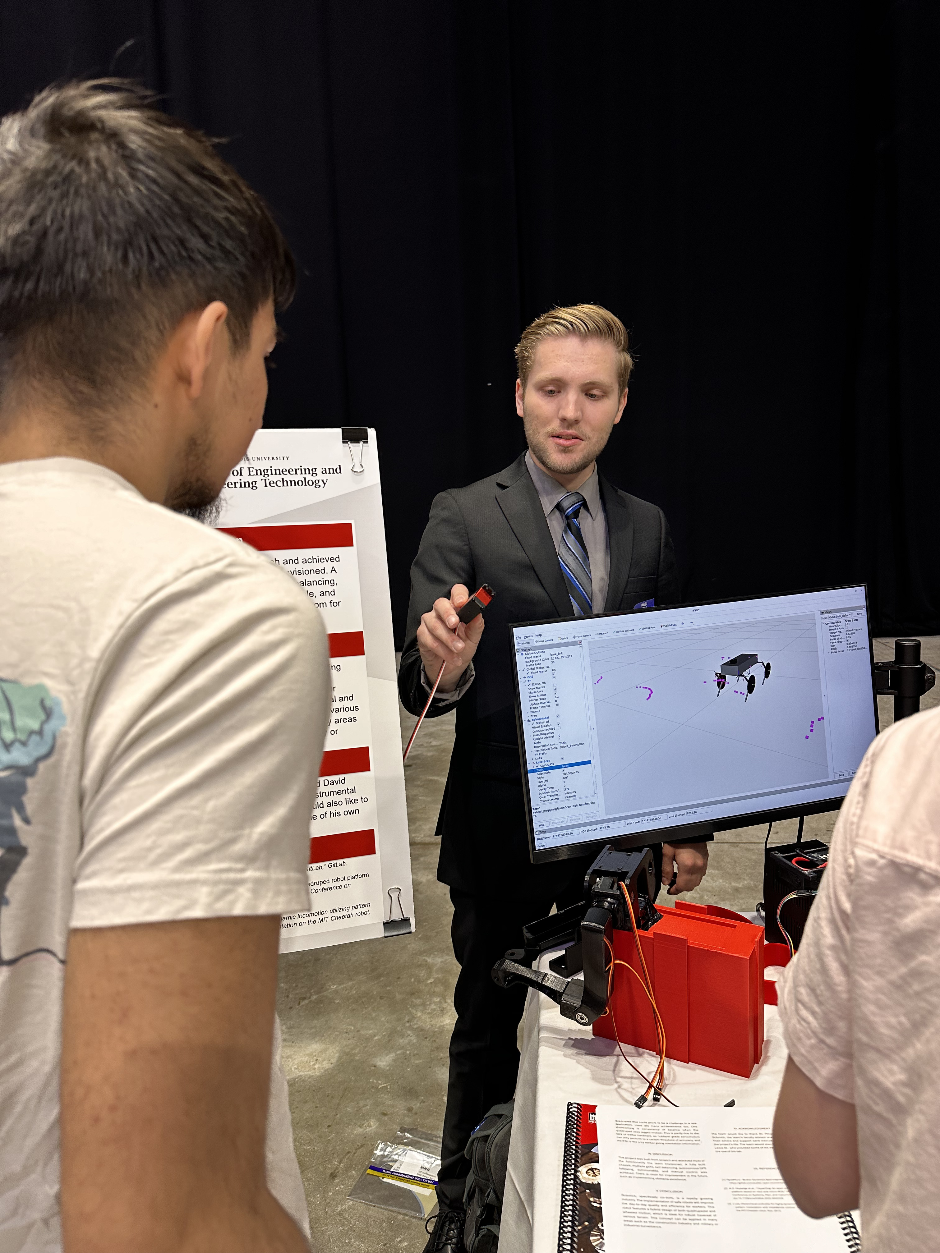 Presenting the Robot on NIU's Senior Design Demo Day with the active data streamed to RViz2