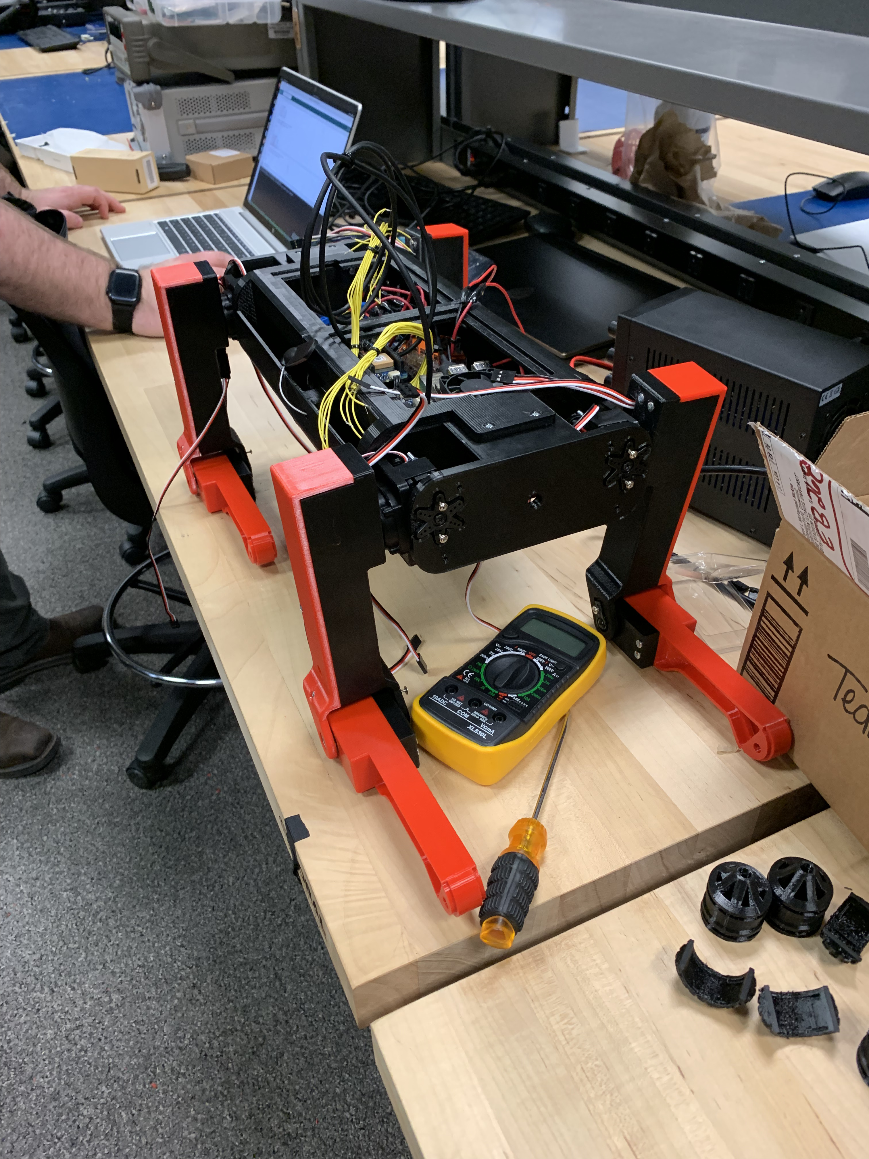 Completed Quadruped Robot on our team's workbench